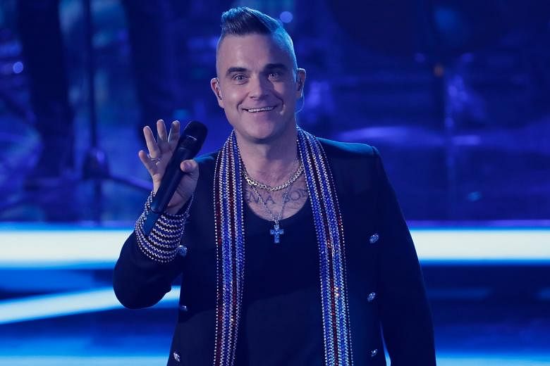 Robbie Williams menyamai rekor Elvis Presley untuk album No.1 Inggris terbanyak oleh artis solo